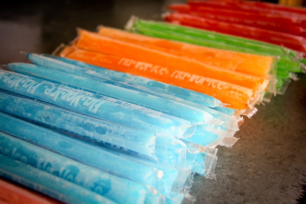 Blue, orange, and green freezepops.